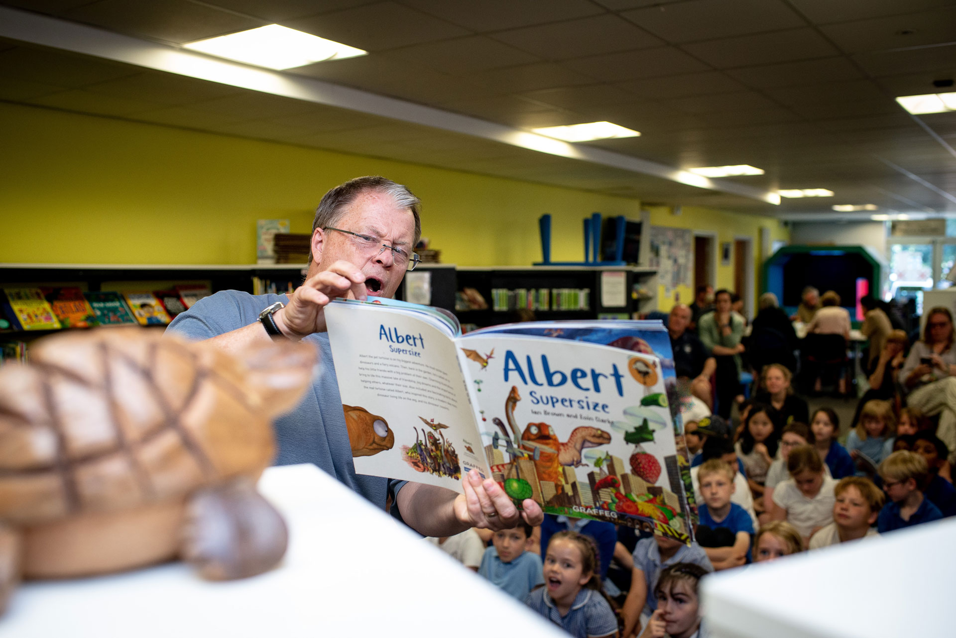 Author Ian Brown reading to children from his book Albert Supersize at a library